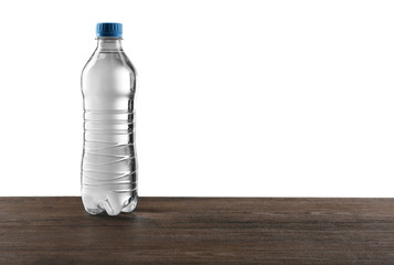 Bottled water on the grey background, close up