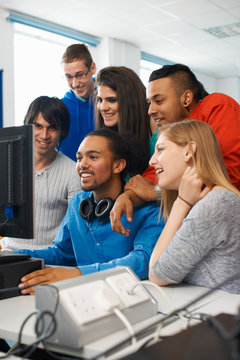 Group of college students using computer