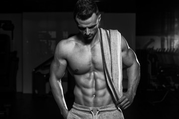 Fototapeta na wymiar Portrait Of A Man In Gym With Towel