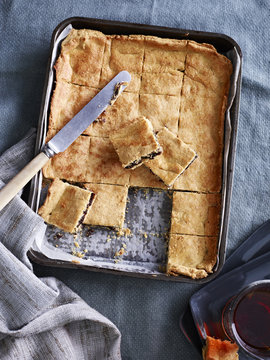 Still life of baking tray with garibaldi slices