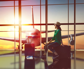 woman looks at a plane