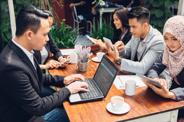 business people busy working with team at a cafe
