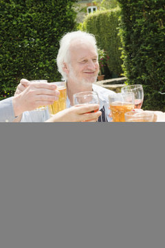 Group Of People Enjoying Food And Drink Outdoors