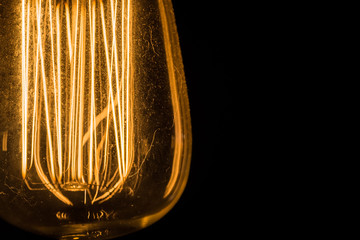 Vintage Edison Light Bulbs hanging against a black background