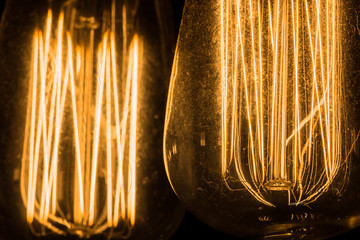 Vintage Edison Light Bulbs hanging against a black background