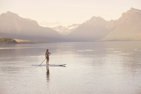 Woman on canoe, Lake McDonald, Glacier National Park, Montana, USA