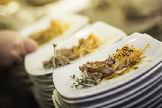 Stacks of plates with starters
