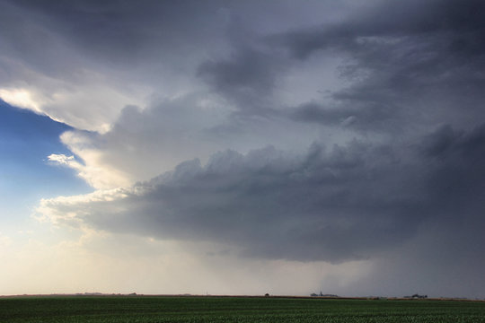 Rapidly rotating wallcloud with striations about the updraft base forms over rural area, Lexington, Nebraska, USA