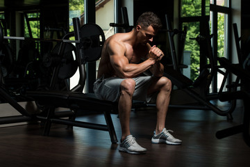 Fototapeta na wymiar Bodybuilder Resting After Exercising