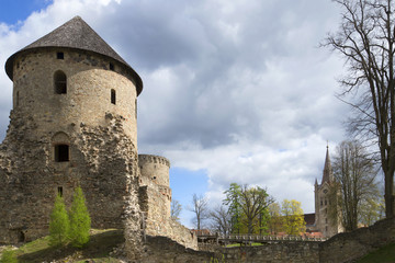 Fototapeta na wymiar Cloudy spring day in the medieval castle of Cesis. Latvia