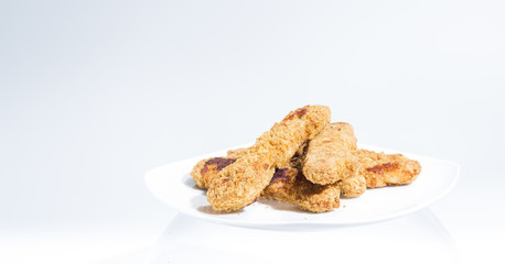 Plate of Chicken Fingers, Fried Frozen Food at Home