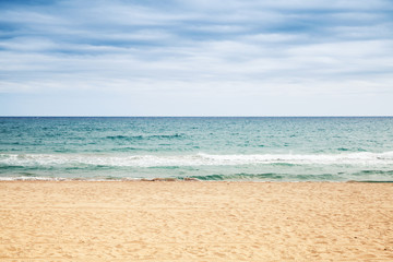 Fototapeta na wymiar Empty sandy beach. Mediterranean sea coast