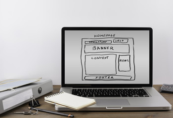 Office desk with a laptop. Website wireframe