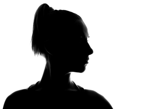 Hidden face in the shadow.Female silhouette.