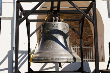 Obraz premium Ancient bells of Veliky Novgorod at the Sofia belfry in the Kremlin of Novgorod. Antique large Church bell. The bells of the Christian Orthodox Church of Russia.