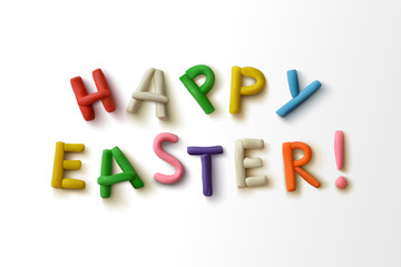 Happy easter! Inscription of colorful plasticine letters.