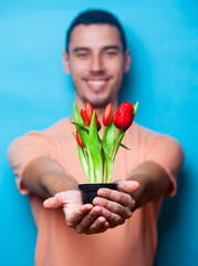 portrait of young man with tulips