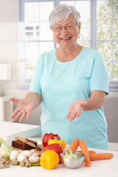 Happy granny preparing healthy food