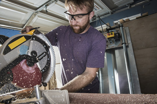 Joiner in garage using circular saw