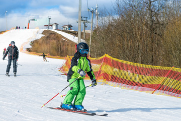 skier on the slope in sunny day