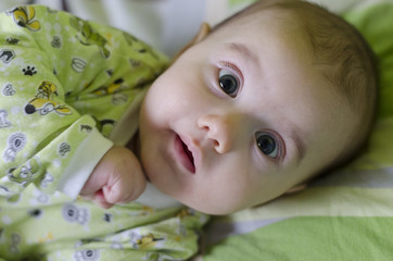 Baby girl with curiosity expression on her face