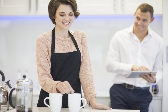 Couple taking a coffee break in kitchen