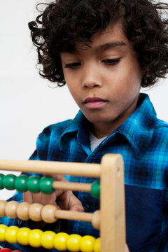 Boy playing with abacus