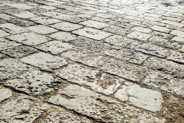 Stone paved road as background