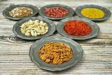 Spices and herbs in metal bowls. Food and cuisine ingredients.