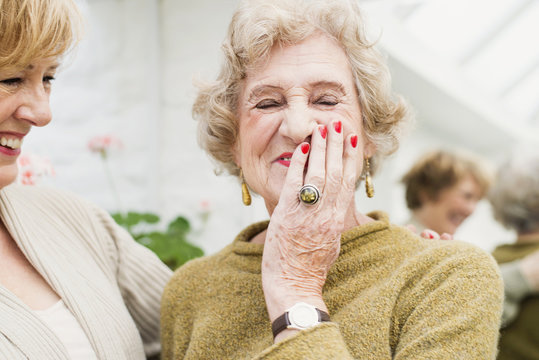 Senior woman with daughter, laughing