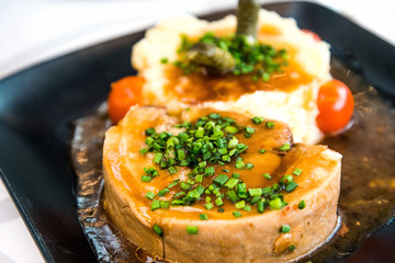 juicy steak veal - beef meat with tomato and potatoes