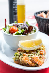 salmon and lemon - french cuisine dish with tomato and salmon