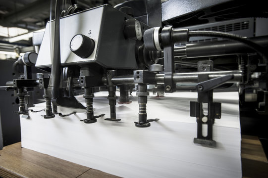 Paper prepared in printing machine in print workshop