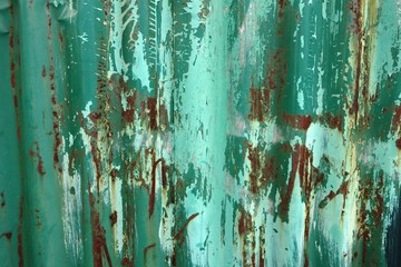 Rusted corrugated green metal sheet