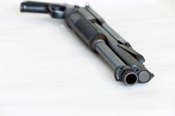 pump action shotgun isolated on white