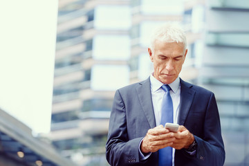 Portrait of confident businessman outdoors