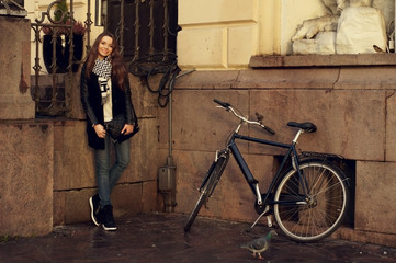 pretty brunette girl with bicycle