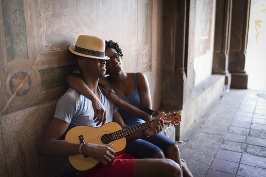 Young couple sitting with mandolin 