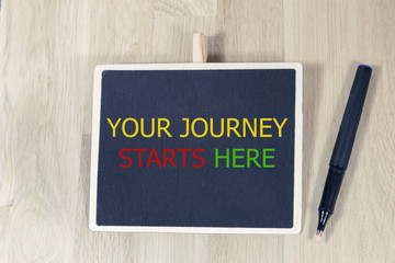 your journey starts here written on a chalkboard