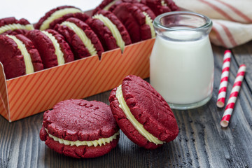 Red velvet sandwich cookies with cream cheese filling