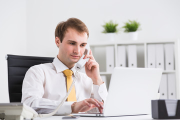 Businessman speaking on phone