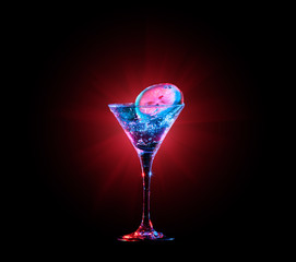 Colourful cocktail in glass with splash