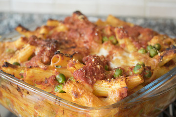 meaty baked rigatoni in an  oven pan of glass
