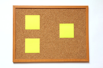 Fototapeta premium Cork board with paper note placed on white background
