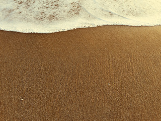 White sea foam on an evening beach, Bali