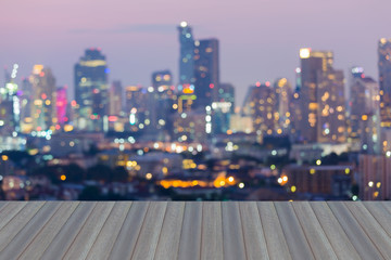 Opening wooden floor, Abstract blurred bokeh city lights downtown background