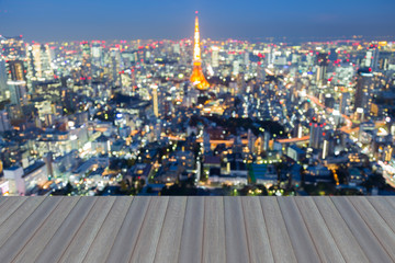 Obraz premium Opening wooden floor, Blurred bokeh lights background, Tokyo city downtown, Japan