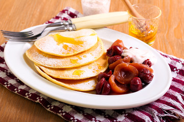Pancakes with fruit salad,
