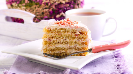 Slice of layered cake with topping