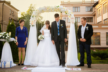wedding couple , groomsman and bridesmaid are during wedding ceremony